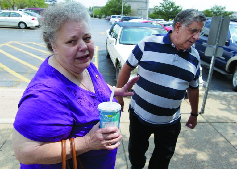 Henry and Marcia Savio, father and stepmother of Kathleen Savio enter the Will County Courthouse, Tuesday, July 31, 2012, in Joliet, Ill. for opening statements in former Bolingbrook police officer Drew Peterson's murder trial. Peterson is charged in the 2004 death of his third wife Kathleen Savio. (AP Photo/M. Spencer Green)