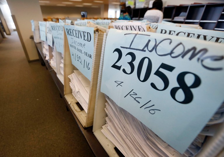 Friday's monthly jobs report disappointed, causing bank economists to lower their predictions of how much the economy will grow in 2016. (AP Photo/Rogelio V. Solis)