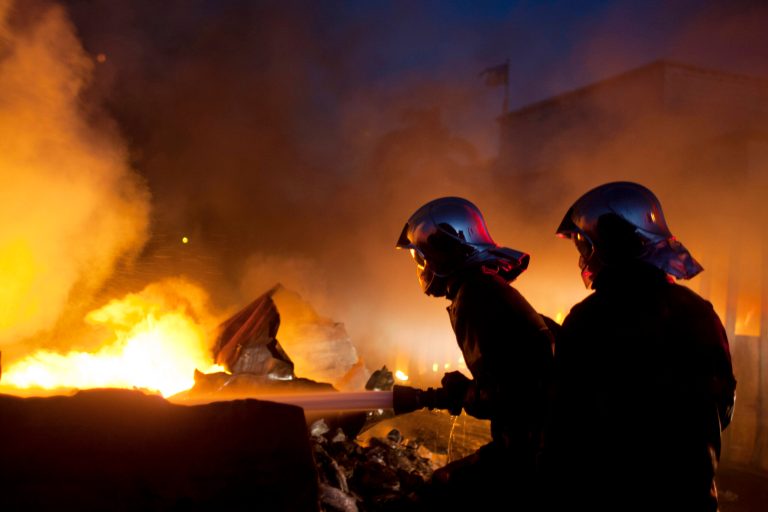   Firefighters work to extinguish a massive fire at Port Market in Port-au-Prince, Haiti, Saturday, Dec. 29, 2012. Police spokesman Frantz Lerebours said Saturday that dozens of stalls at the popular marketplace were burned to the ground and that few items were recovered. Authorities are investigating what caused the late Friday fire. (AP Photo/Dieu Nalio Chery)  