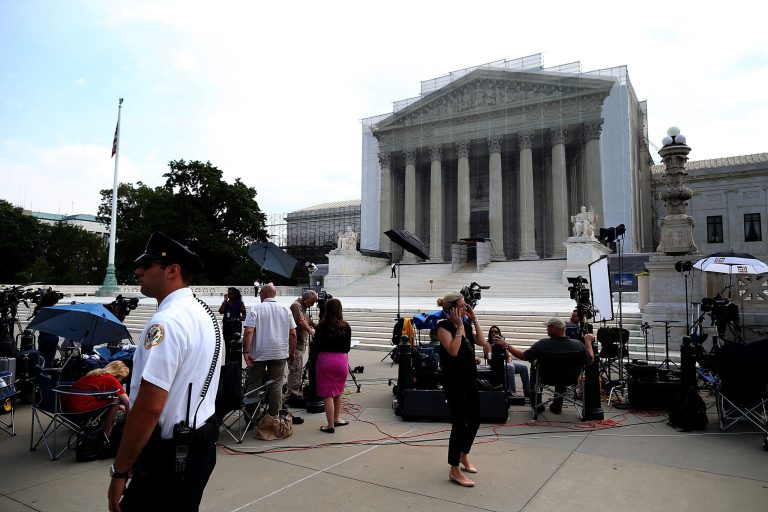 Members of the media wait for court rulings in front of the U.S. Supreme Court in Washington. (Mark Wilson/Getty Images)