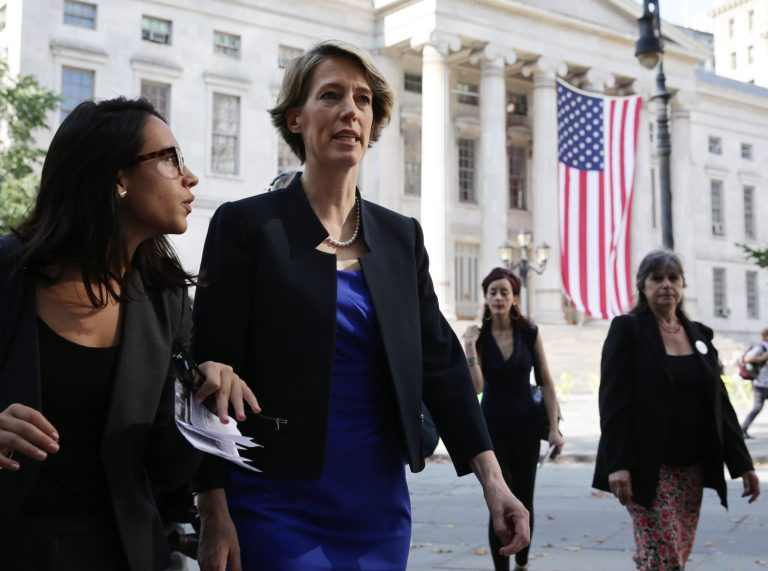 Fordham University law professor and liberal activist Zephyr Teachout, right, walks past Brooklyn Borough Hall in in New York on Thursday, Aug 7, 2014. Teachout was heading to a nearby court where she faces a residency challenge designed to prevent her Democratic Primary challenge to Gov. Andrew Cuomo. (AP Photo/Peter Morgan)