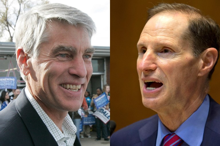 Sens. Mark Udall, D-Colo., and Ron Wyden, D-Ore. (AP images)