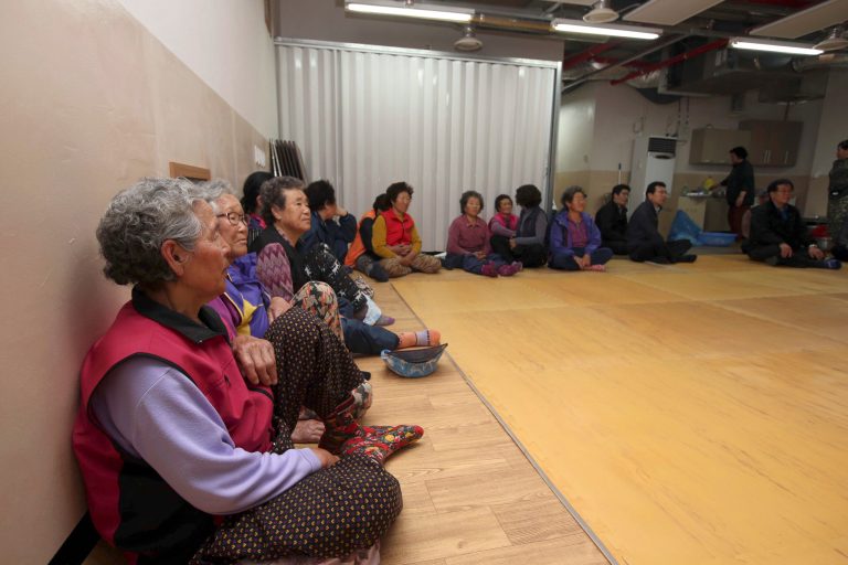 In this photo provided by the Ongjin County, residents of Socheong Island sit in a shelter after their evacuation on the island, South Korea, near the West Sea border with North Korea, Tuesday, April 29, 2014. North Korea conducted live-fire artillery drills Tuesday near the countries' disputed western sea boundary, South Korean military officials said, in a possible indication of rising frustration in Pyongyang as it unsuccessfully pushes for outside aid. (AP Photo/Ongjin County)