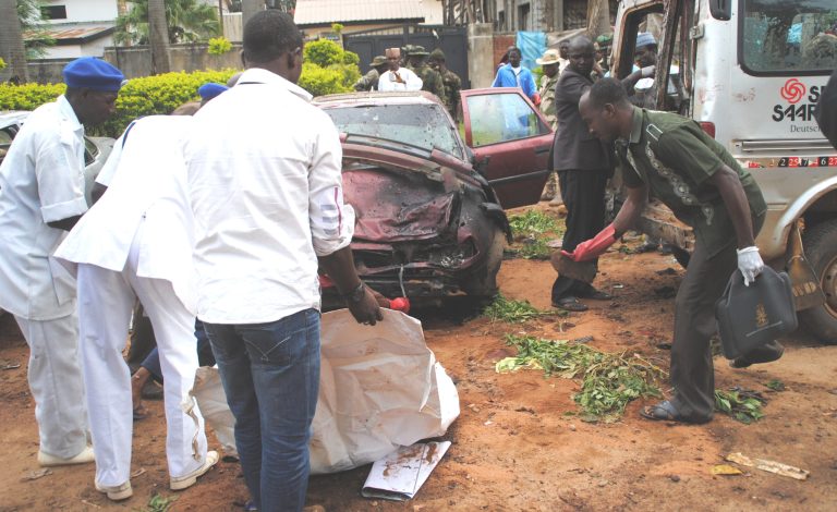Rescue workers at the scene of an explosion  in Kaduna, Nigeria. Wednesday, July 23, 2014. Police say at least 25 people were killed Wednesday by two bombings in the northern city of Kaduna. Police Commissioner Umar Usman Shehu said the first blast came after Sheik Dahiru Bauchi gave an annual Ramadan speech for thousands of faithful in an outdoor service. Sheik Bauchi is known for preaching against the violent extremism of Nigeria's Islamic militants, Boko Haram. (AP Photo)
