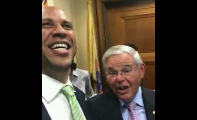 Watch: Al Franken leaps out at Cory Booker in birthday surprise