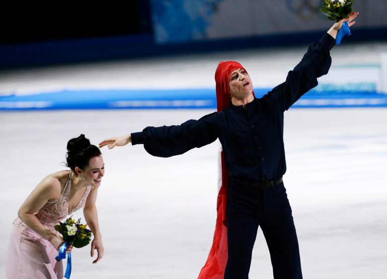 Tessa Virtue and Scott Moir of Canada celebrate placing second in the ice dance free dance figure skating finals at the Iceberg Skating Palace during the 2014 Winter Olympics, Monday, Feb. 17, 2014, in Sochi, Russia. (AP Photo/Bernat Armangue)