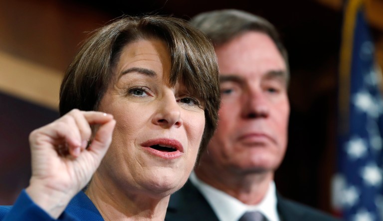 Sen. Amy Klobuchar, D-Minn., left, and Sen. Mark Warner, D-Va., speak about online political ads and preventing foreign interference in U.S. elections, during a news conference, Thursday, Oct. 19, 2017, on Capitol Hill in Washington. (AP Photo/Jacquelyn Martin)