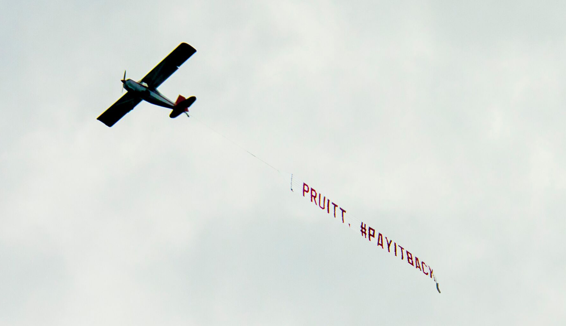 Environmental groups buzz EPA chief Scott Pruitt in elaborate plane protest
