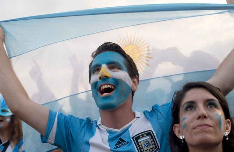 Soccer fans of the Argentina national soccer team cheer during a live telecast of the soccer World Cup semifinal match between Argentina and The Netherlands, inside the FIFA Fan Fest area on Copacabana beach, in Rio de Janeiro, Brazil, Wednesday, July 9, 2014. (AP Photo/Silvia Izquierdo)