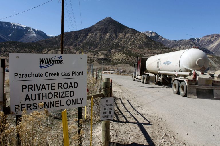 A truck enters the gate to the Williams natural gas plant north of Parachute, Colo., in March 2013. (AP Photo/Brennan Linsley)