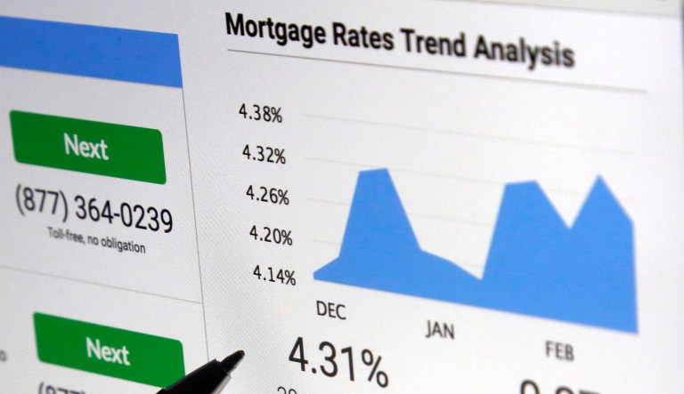 FILE - In this March 6, 2017, file photo, a mortgage rate graph is displayed on a computer in North Andover, Mass. (AP Photo/Elise Amendola, File)