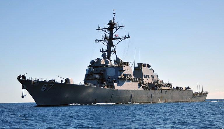 In this 2014 photo, the guided missile destroyer USS Cole approaches Mole Pier at Naval Air Station Key West, Fla., for a port visit. On Tuesday, prosecutors were ordered to draft warrants for two civilian attorneys who had left the USS Cole terrorism case.
			(DoD photo by Mass Communication Specialist 2nd Class Brian Morales, U.S. Navy/Released via Wikimedia Commons)