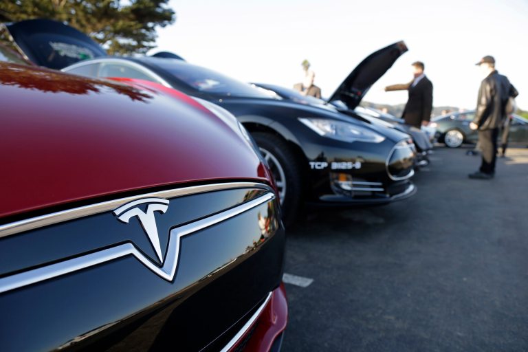 A row of Tesla Motors Model S electric sedans are shown during a demonstration on Oct. 31 at Crissy Field in San Francisco. Tesla Motors, the California-based maker of the Model S electric sedan, has completed the West Coast Supercharger route enabling Tesla owners to travel free between San Diego and Vancouver, BC. (AP Photo/Eric Risberg)