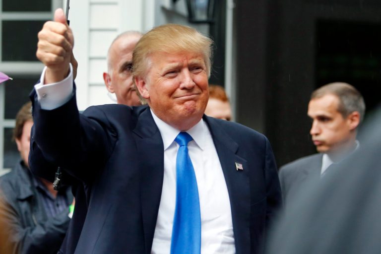In this June 30, 2015, file photo, Republican presidential candidate Donald Trump waves as he arrives at a house party in Bedford, N.H. (AP Photo/Jim Cole. File)