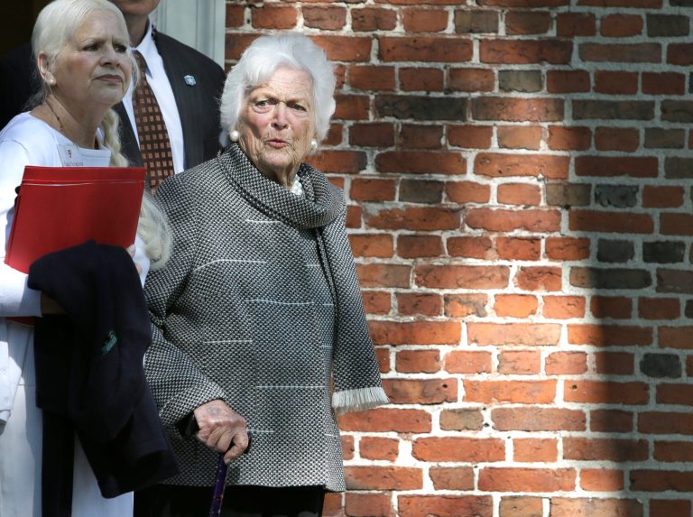 Former First Lady Barbara Bush steps out of Massachusetts Hall on the campus of Harvard University before Harvard commencement ceremonies, Thursday, May 29, 2014, in Cambridge, Mass. (AP Photo/Steven Senne)