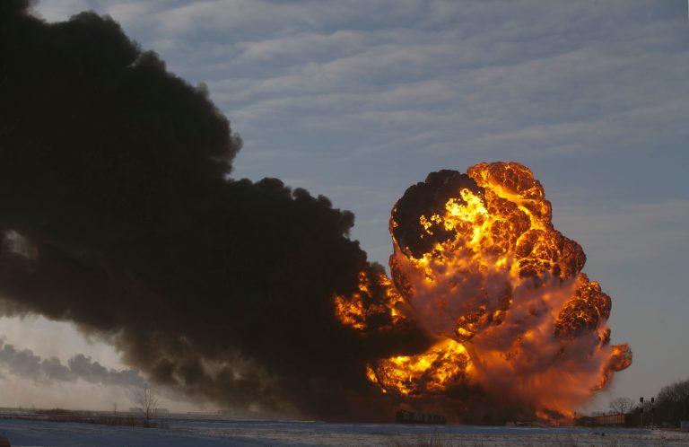 A fireball goes up at the site of an oil train derailment Monday, Dec 30, 2013, in Casselton, N.D. The train carrying crude oil derailed near Casselton Monday afternoon. Several explosions were reported as some cars on the mile-long train caught fire. (AP Photo/Bruce Crummy)