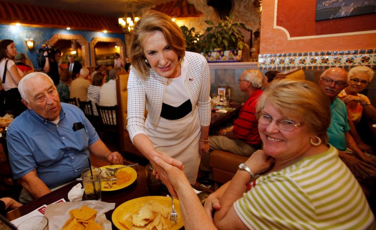 Republican presidential candidate, former Hewlett-Packard CEO Carly Fiorina, reaches out to shake hands at a luncheon hosted by the Derry Republican Town Committee, Tuesday, May 26, 2015, in Derry, N.H. (AP Photo/Jim Cole)