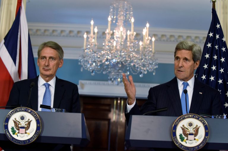 Secretary of State John Kerry, accompanied by British Foreign Secretary Phillip Hammond speaks during a media availability at the State Department in Washington, Wednesday, Oct. 8, 2014. (AP Photo/Susan Walsh)