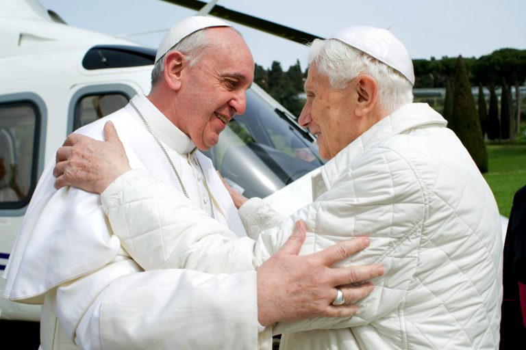 In this photo provided by the Vatican paper L'Osservatore Romano, Pope Francis meets Pope emeritus Benedict XVI in Castel Gandolfo Saturday, March 23, 2013. Pope Francis has traveled to Castel Gandolfo to have lunch with his predecessor Benedict XVI in a historic and potentially problematic melding of the papacies that has never before confronted the Catholic Church. The Vatican said the two popes embraced on the helipad. In the chapel where they prayed together, Benedict offered Francis the traditional kneeler used by the pope. Francis refused to take it alone, saying 