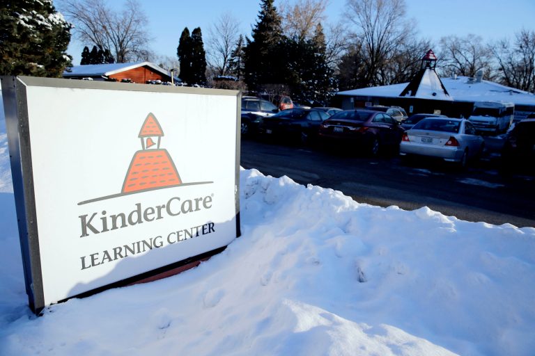 Snow rests at the bottom of a KinderCare Learning Center sign on East Palatine Road, Thursday, Feb. 5, 2015, in Palatine, Ill. (AP Photo/Nam Y. Huh)