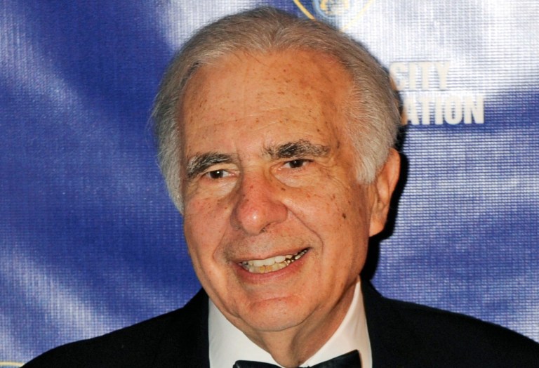FILE - In this March 16, 2010 file photo, financier Carl Icahn poses for photos upon arriving for the 32nd annual New York City Police Foundation Gala in New York. Under a deal announced Thursday, April 10, 2014, Icahn is backing down from his push to remake eBay, settling an acrimonious dispute just ahead of what promised to be an awkward annual shareholders meeting. (AP Photo/Henny Ray Abrams, File)