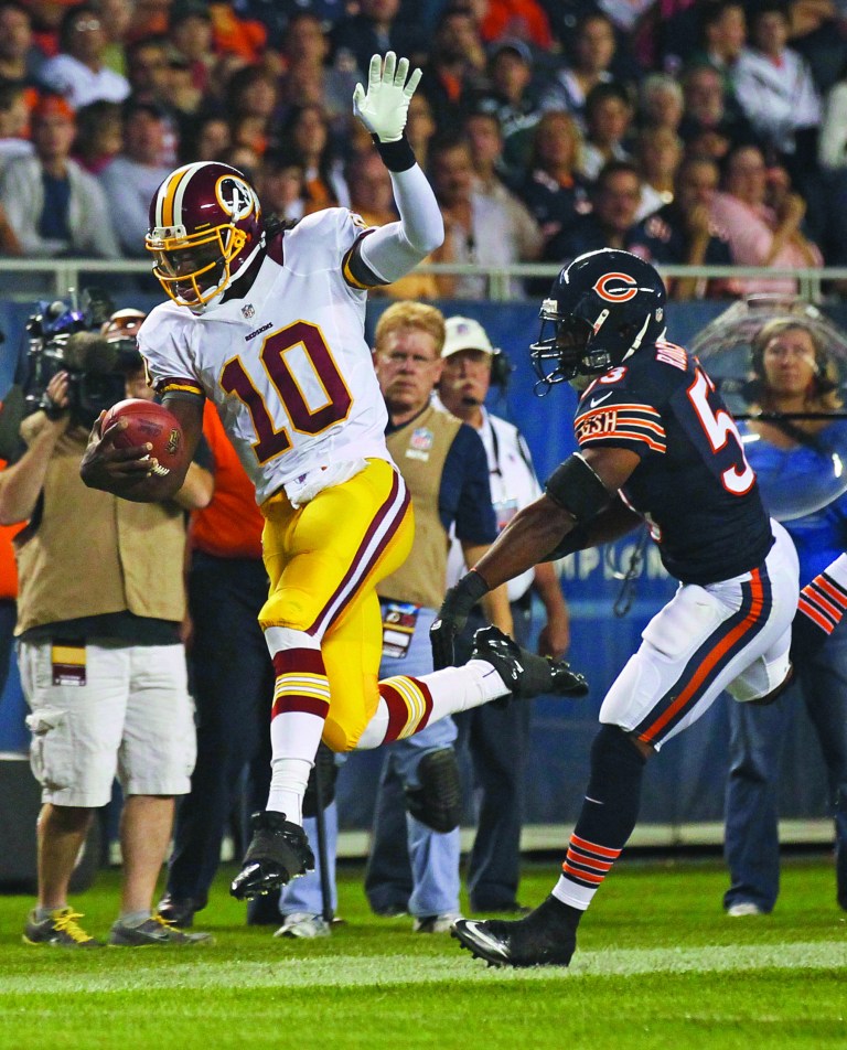 Charles Rex Arbogast/AP
Robert Griffin III completed five of eight passes for 49 yards and was sacked three times in the first half against the Bears.