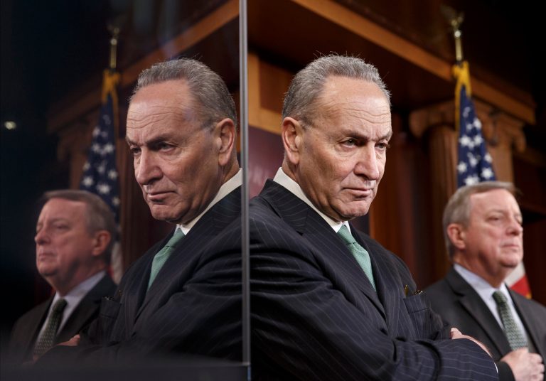 Sen. Charles Schumer, D-N.Y., the Democratic Policy Committee chairman, left, and Senate Majority Whip Richard Durbin of Ill., are reflected in a TV monitor as they tell reporters that Republicans are thwarting Democratic efforts pass a bill to extend unemployment benefits which expired at the end of last year, Thursday, Feb. 6, 2014, during a news conference on Capitol Hill in Washington. (AP Photo/J. Scott Applewhite)