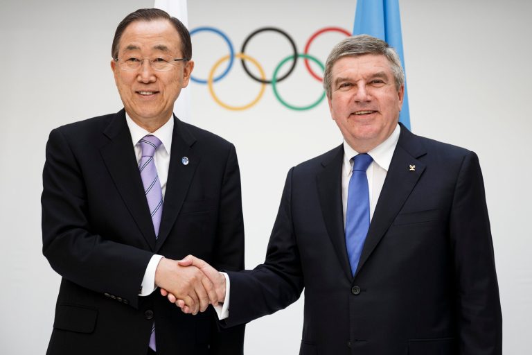 International Olympic Committee (IOC) president, Thomas Bach, right,  shakes hands with  United Nations (UN) Secretary General, Ban Ki-moon, left, at the IOC Headquarters in Lausanne  Tuesday June 17 2014. The two leaders met to discuss the cooperation between the two organizations. (AP Photo/Keystone, Valentin Flauraud)