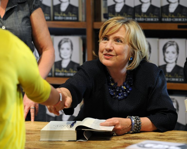 Hillary Clinton signs copies of her book on October 2, 2014 in Coral Gables, Florida.(AP/Jeff Daly)
