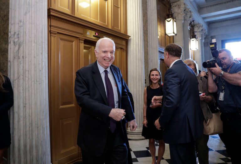 Sen. John McCain, R-Ariz., who returned to Capitol Hill after being diagnosed with an aggressive type of brain cancer, smiles as he arrives to vote as the Republican-run Senate rejected a GOP proposal to scuttle President Barack Obama's health care law, Wednesday, July 26, 2017, in Washington. President Donald Trump and Senate Majority Leader Mitch McConnell, R-Ky., have been stymied by opposition from within the Republican ranks. (AP Photo/J. Scott Applewhite)