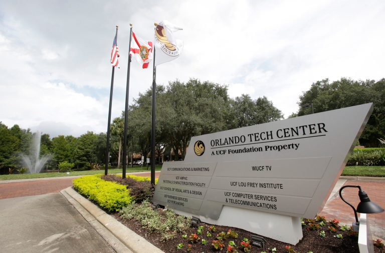ADVANCE FOR USE SUNDAY, OCT. 12 - In this Wednesday, Sept. 24, 2014 photo, the entrance to the Orlando Tech Center, a foundation property at the University of Central Florida is seen in Orlando, Fla. Private corporations control hundred of millions of dollars that flow into and out of Florida's public universities but the corporations have no obligations to disclose who they get the donations from. (AP Photo/John Raoux)