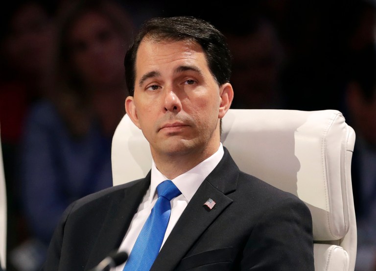 Wisconsin Gov. Scott Walker emphasized party unity and pointed to Indiana Gov. Mike Pence's selection as Donald Trump's running mate as a reason for Republicans to support Trump. (AP Photo/Charlie Neibergall)