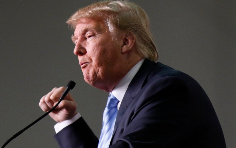 "I was gonna hit a number of those speakers so hard their heads would spin — they'd never recover," Trump said. (AP Photo/Paul Vernon)