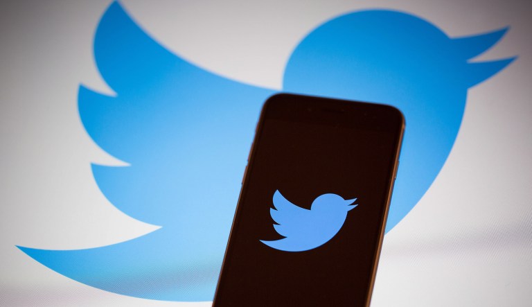 The Twitter logo is displayed on the screen of an Apple iPhone 6s in this arranged photograph taken in New York on Tuesday, Feb. 9, 2016.