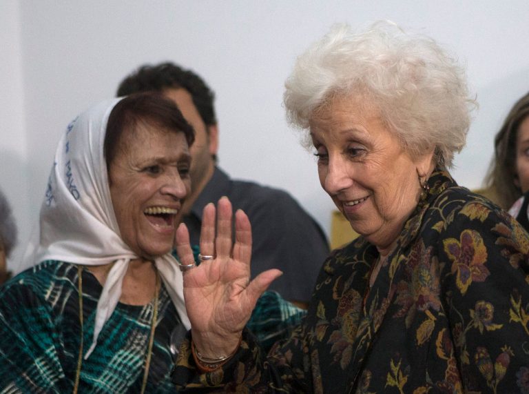Estela de Carlotto, right, president of the Grandmothers of Plaza de Mayo, Argentina's leading human rights group, waves next to Taty Almeida one of the group's grandmothers, as she arrives to announce that tests have identified the granddaughter of one of the group's late founders Alicia Zubasnabar de la Cuadra, In Buenos Aires, Argentina, Friday, Aug. 22, 2014. Zubasnabar de la Cuadra the Grandmothers' first president, died in 2008, her daughter gave birth while a prisoner of the 1976-83 military dictatorship and hasn't been seen since. (AP Poto/Eduardo Di Baia)