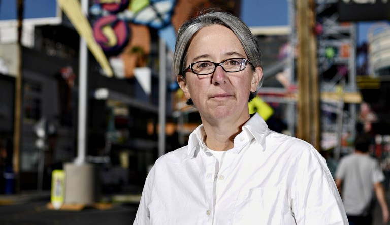 Becky Bond, a former senior adviser to the Bernie Sanders 2016 presidential campaign, stands for a photograph on Fremont Street in Las Vegas, Nevada.
