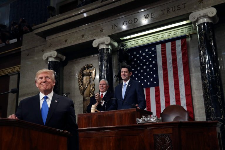 President Donald Trump gestures as delivers his first State of the Union address in the House chamber of the U.S. Capitol to a joint session of Congress Tuesday, Jan. 30, 2018 in Washington, as Vice President Mike Pence and House Speaker Paul Ryan applaud. (Win McNamee/Pool via AP)