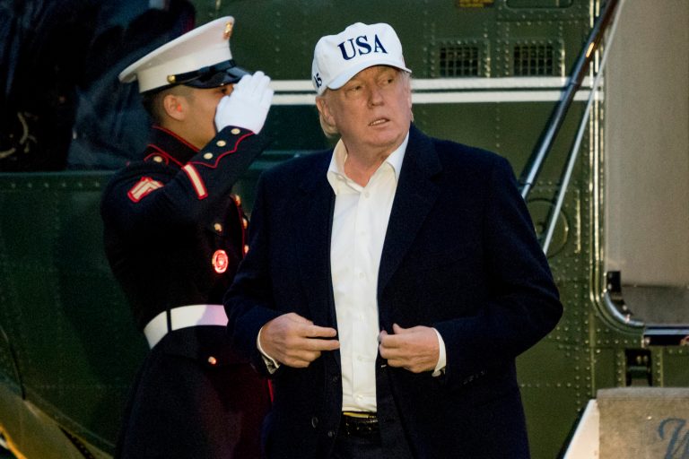 President Donald Trump steps off Marine One on the South Lawn at the White House in Washington, Sunday, Dec. 17, 2017, after returning from Camp David in Maryland. (AP Photo/Andrew Harnik)