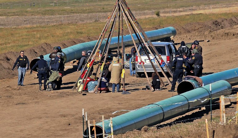 The Obama administration is holding up the construction of the Dakota Access pipeline, despite the project's court victory Sunday night over a North Dakota Indian tribe opposing the oil pipeline. (Tom Stromme/The Bismarck Tribune via AP)