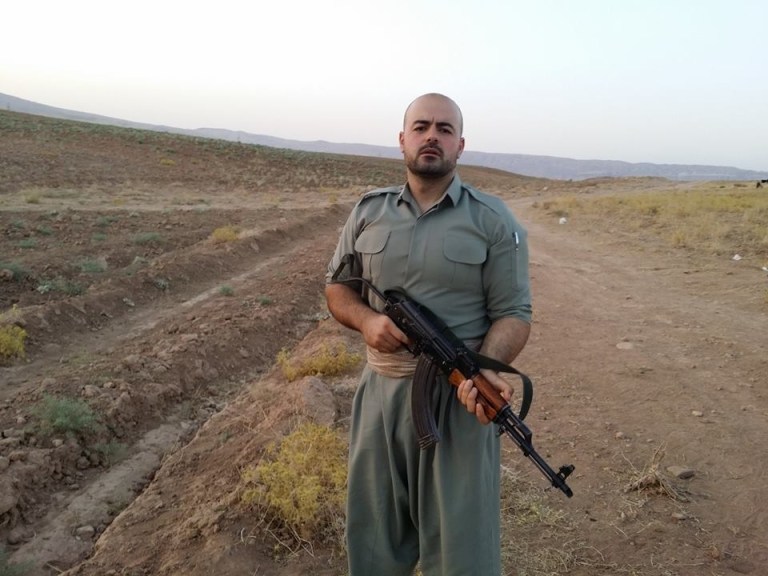 In this image provided by Shaho Pirani shows  Shaho Pirani posing with an automantic weapon near the village of Koya in Iraqi Kurdistan in June 2014. The Iranian Kurd living in Denmark, was on a month-long training camp for the Kurdish diaspora organized by Iranian branch of the Kurdistan Democratic Party. He joined Kurds from Norway, Switzerland and Britain for a crash-course on politics followed by weapons training. Shaho Pirani says he's just a phone call away from leaving his quiet life in Denmark and joining Kurdish forces battling against Islamic State militants in Iraq. The 30-year-old Kurd, who fled from Iran with his older brother in 1991, says he feels a moral duty to help the Peshmerga, the armed forces of the Kurdistan Regional Government, to fight the 