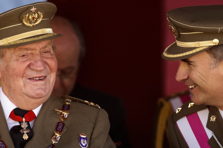 King Juan Carlos and Crown Prince Felipe, right, attend a military ceremony in San Lorenzo de El Escorial, outside Madrid, Spain, Tuesday, June 3, 2014.  Spanish Prime Minister Mariano Rajoy is holding an emergency cabinet meeting to draft the legal process for King Juan Carlos to abdicate and be replaced by his son, Crown Prince Felipe. The handover cannot happen until the government crafts the mechanism for abdication and Felipe's assumption of power. The proposal is expected to pass quickly because Rajoy's center-right Popular Party has an absolute majority in Parliament. (AP Photo/Daniel Ochoa de Olza)