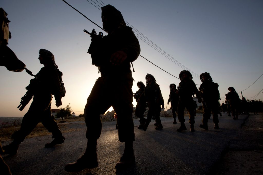 Israel cracks down on Hamas amid search for teens