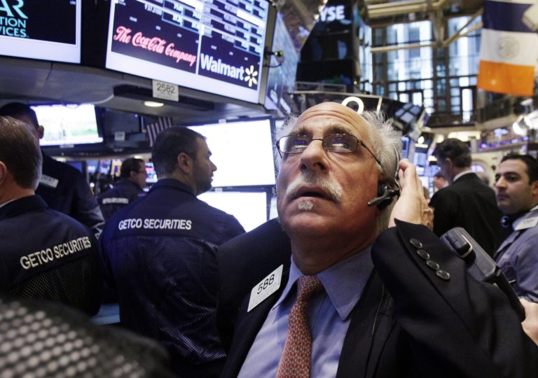   FILE - In this Thursday, Dec. 6, 2012 file photo, trader Peter Tuchman works on the floor of the New York Stock Exchange, in New York. Stocks are opening mixed on Wall Street, Monday, Dec. 10, 2012, after the surprise resignation of Italy's prime minister sent a jolt through European markets. (AP Photo/Richard Drew, File)  