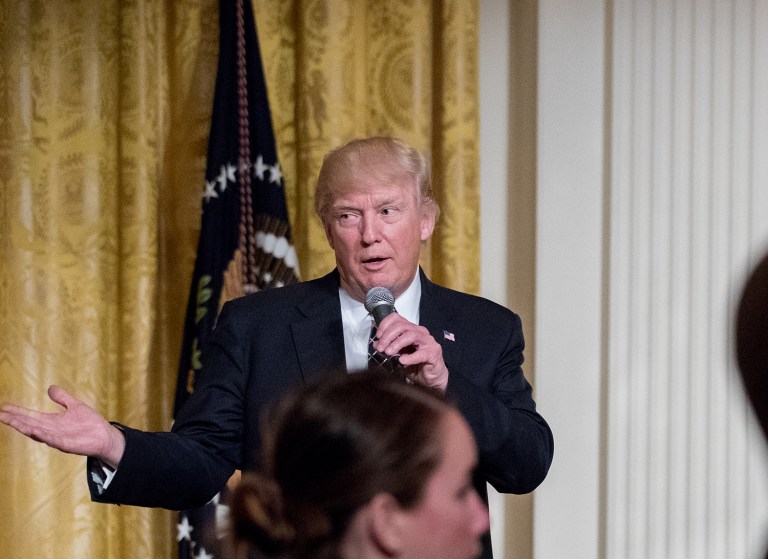 President Donald Trump speaks at a reception for Senators and their spouses in the East Room of the White House. (AP Photo/Andrew Harnik)