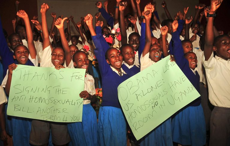 Ugandan pupils from different schools take part in an event organised by born-again Christians to celebrate the signing of a new anti-gay bill that sets harsh penalties for homosexual sex, at the Omega Healing Center outside of Kampala, in Uganda Monday, Feb. 24, 2014. Uganda's President Yoweri Museveni on Monday signed the controversial anti-gay bill into law, with penalties including 14 years in jail for first-time offenders and life imprisonment as the maximum penalty for 