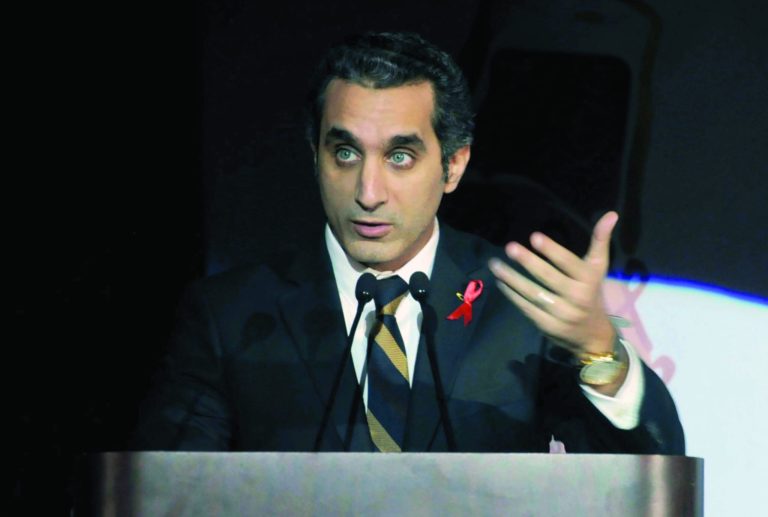 In this Saturday Dec. 8, 2012 photo, Egyptian TV host Bassem Youssef addresses attendants at a gala dinner party in Cairo, Egypt. Egyptian prosecutors launched an investigation on Tuesday against Youssef a popular television satirist for allegedly insulting the president in the latest case raised by Islamist lawyers against outspoken media personalities. The case against Youssef comes as opposition media and independent journalists are growing increasingly worried about press freedoms under a new constitution widely supported by Morsi and his Islamist allies. (AP Photo/Ahmed Omar)