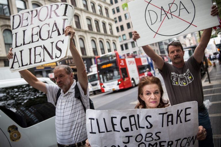 Activists who support recent challenges to President Obama's 'Deferred Action for Parents of Americans and Lawful Permanent Residents' (DAPA) program protest against a seperate group of activists who support DAPA, outside the Jacob K. Javits Federal building, where naturalization ceremonies take place, on May 19, 2015 in New York City. Â (Getty Image)