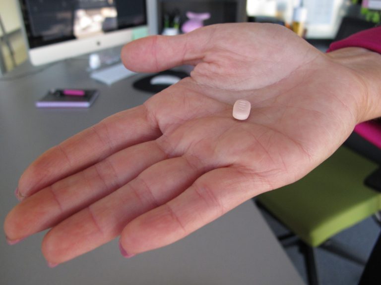 In this Friday, Sept. 27, 2013, photo, Cindy Whitehead holds a tablet of flibanserin in her office at Sprout Pharmaceuticals in Raleigh, N.C. The daily pill is designed to increase libido in women by acting on brain chemicals linked to mood and appetite. (AP Photo/Allen G. Breed)