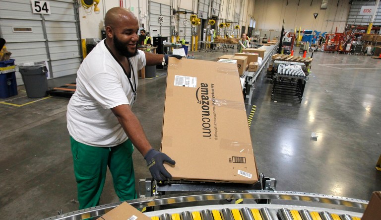 Amazon teamed up with the U.S. Postal Service to deliver packages in 2013. President Trump said Friday that the USPS is undercharging online retailers, such as Amazon, to deliver packages. He said it is 