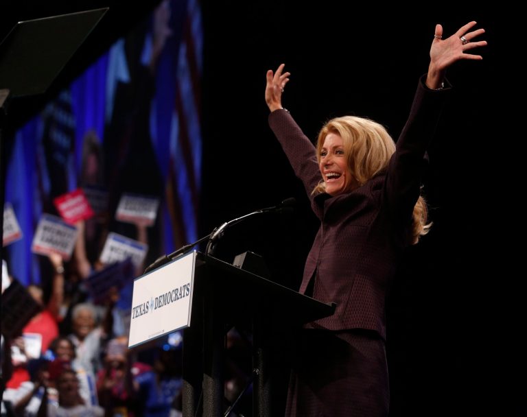 Gubernatorial hopeful and state Sen. Wendy Davis acknowledges the crowd at the Texas Democratic State Convention at the  Dallas Convention Center in Dallas on Friday, June 27, 2014, in Dallas, Texas. Davis became a Democratic sensation nationally with a 12-plus hour Texas Senate filibuster last summer that temporarily delayed passage of strict abortion restrictions statewide. (AP Photo/The Dallas Morning News, Michael Ainsworth)